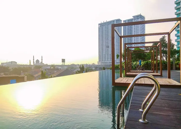 Comfort 1Br Without Living Room At Grand Kamala Lagoon Apartment By Travelio